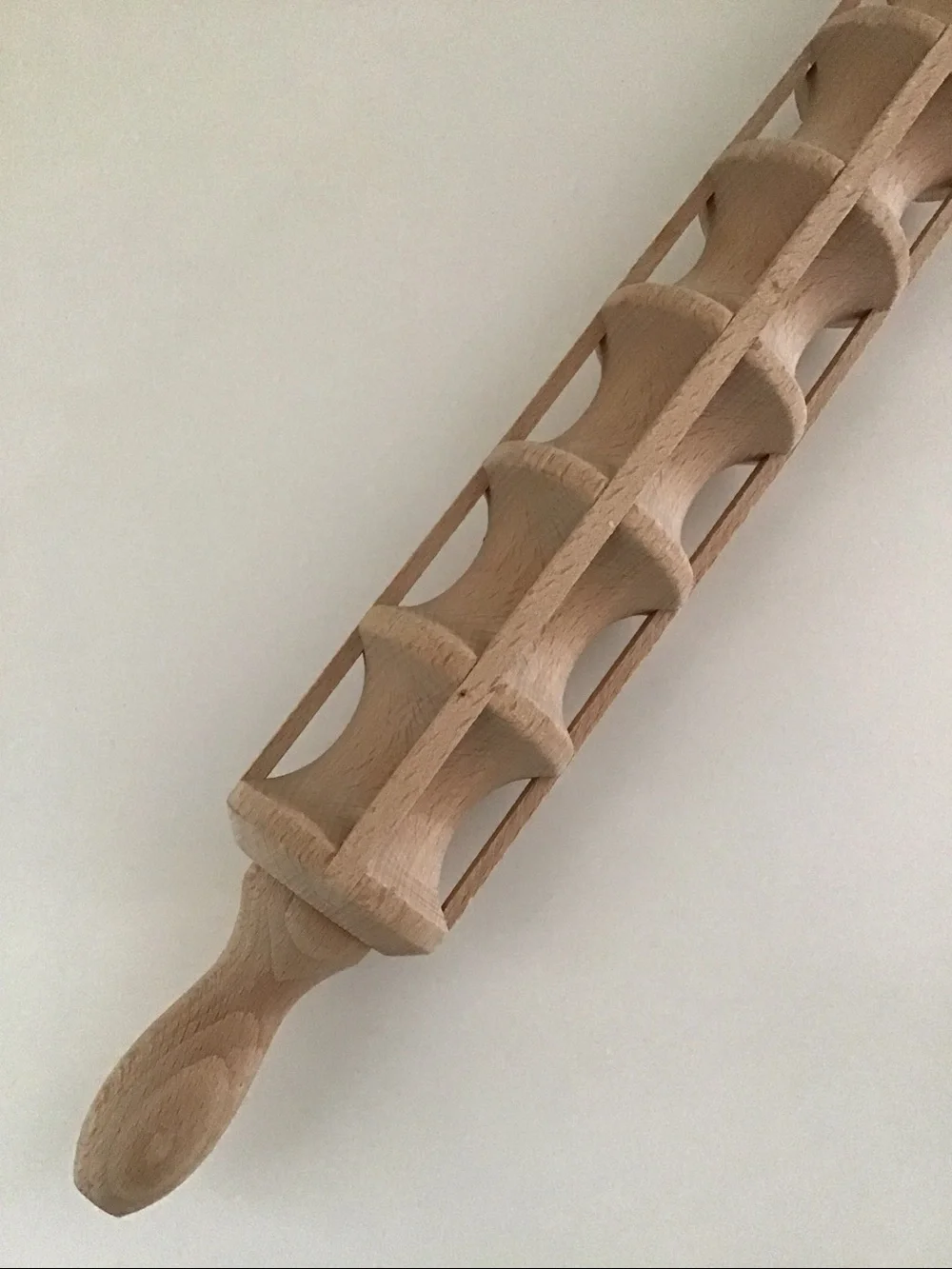 Traditional wooden ravioli rolling pin